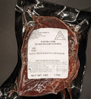 Bison loin tenderloin steaks packaged in vacuum-sealed plastic with a label indicating weight and storage instructions. Ideal for gourmet cooking and high-protein meals.