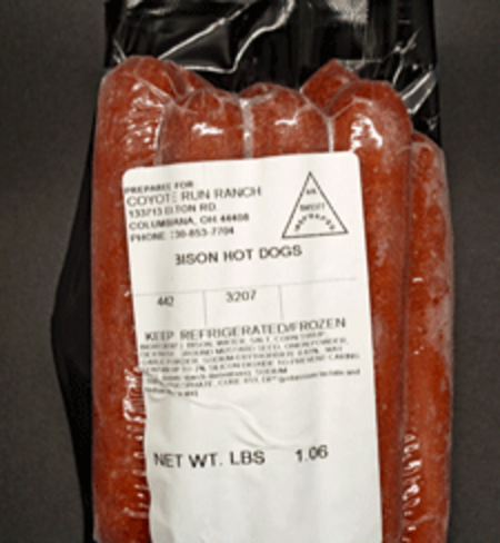 Bison hot dogs packaged for Coyote Run Ranch, featuring a clear label with storage instructions and weight information.